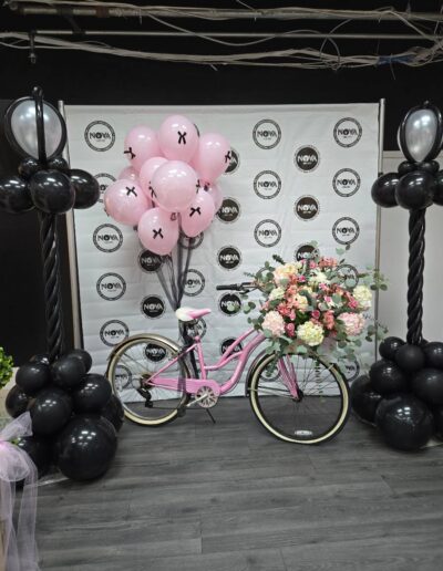 yourstyle2be party decor design with bike, balloons, and flowers